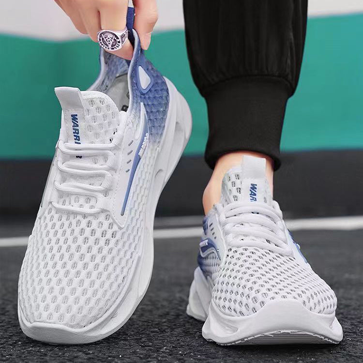 White running shoes with blue accents worn by a person on a road.