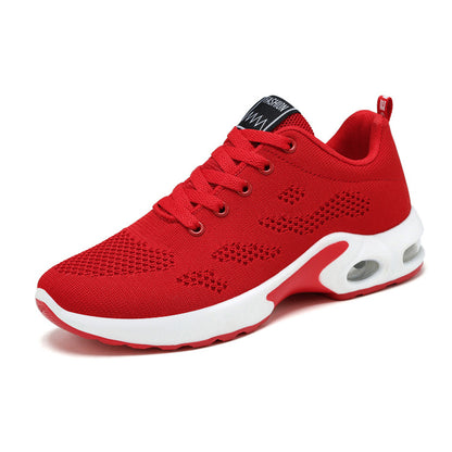 Red athletic shoe with white sole on a white background