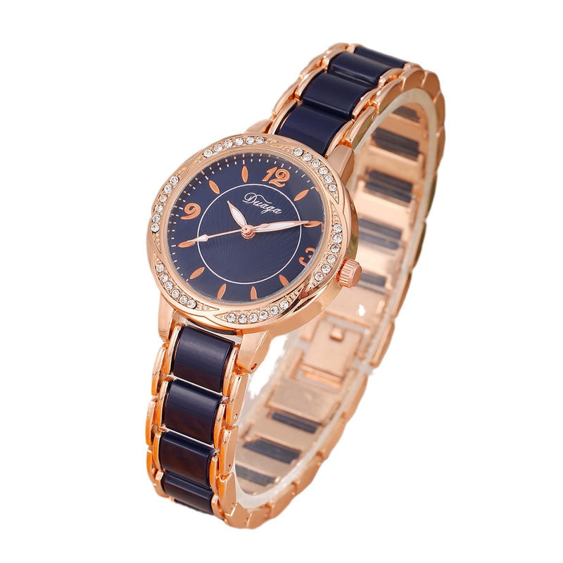 Rose gold round quartz wristwatch with dark blue dial and black link bracelet