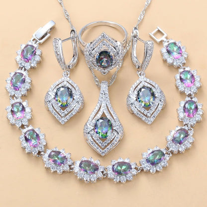 Jewelry set with necklaces, earrings, and a bracelet on a beige background