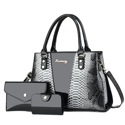 Black-and-silver shoulder tote bag with scalloped texture, front pocket, and wallet