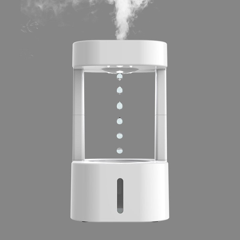 White anti-gravity water drop humidifier with visible droplet column and rising mist