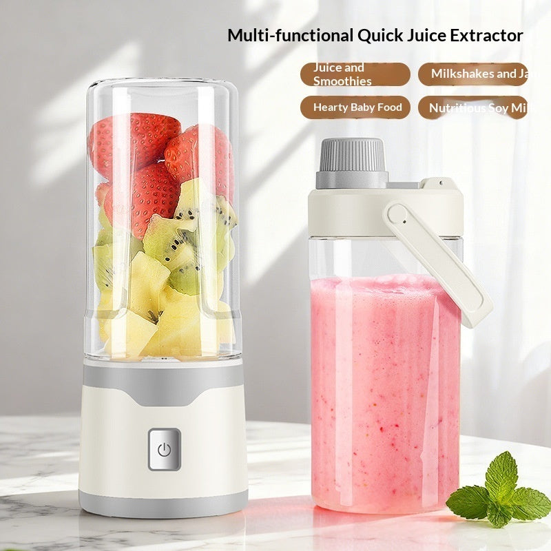Electric USB juicer extractor with clear blending cup and handle top, showing pink drink