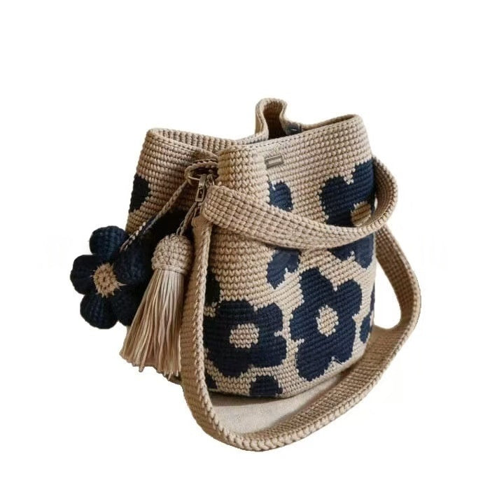 Hand-crocheted flower tote bag in beige with navy-blue floral pattern and tassel