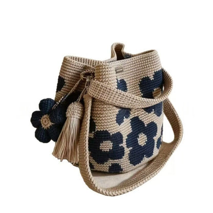 Hand-crocheted flower tote bag in beige with navy-blue floral pattern and tassel