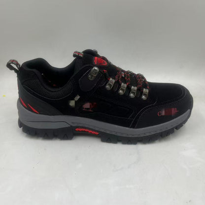 Black hiking shoe with red accents on a white background