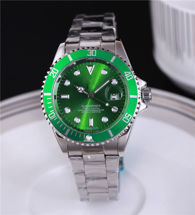 Steel wristwatch with green dial, stainless bracelet, green bezel with minute markers.