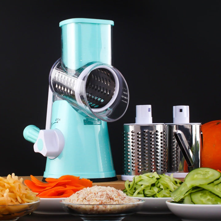 Turquoise manual vegetable spiralizer with sliced vegetables on a black background