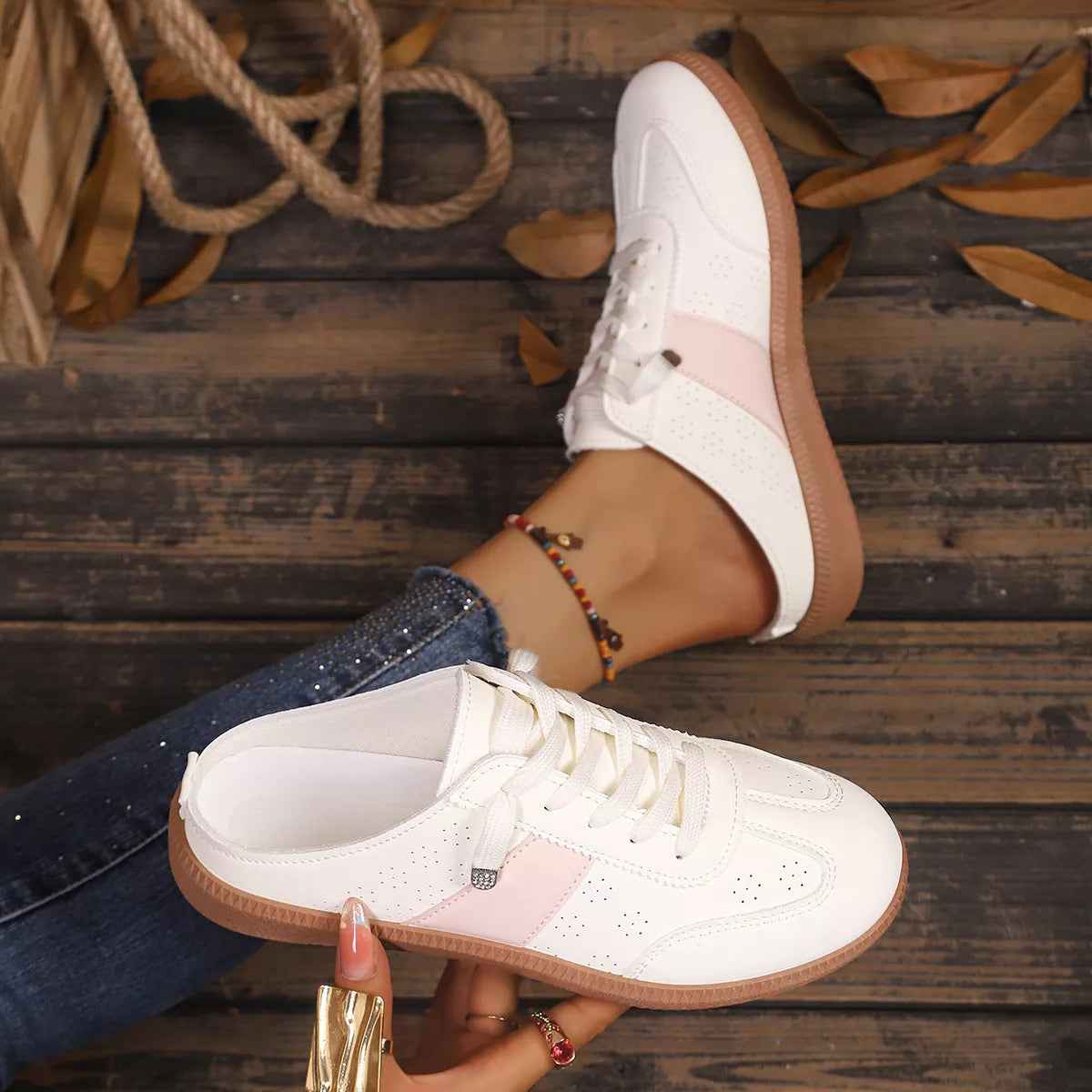 White round-toe sneakers with pink inset, lace-up design, tan gum sole