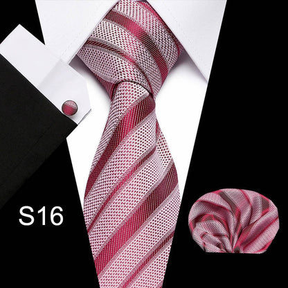 Pink and white striped tie set with pocket square and cufflinks on a black background