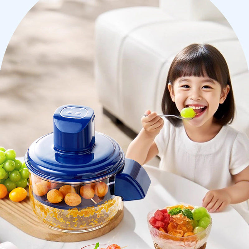 Blue electric grape peeler with clear bowl next to a child eating grapes