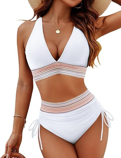Woman wearing a white and pink striped swimsuit with a white background