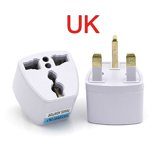 White travel adapter with UK plug design on a white background