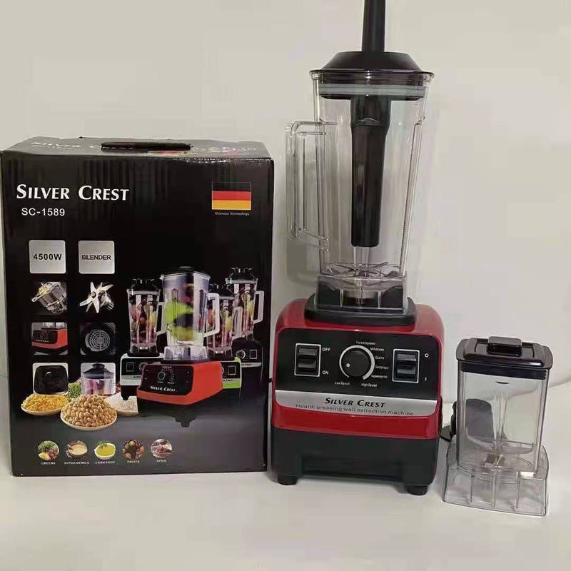 Red and black countertop blender with clear tall jug and small blending cup, plus box
