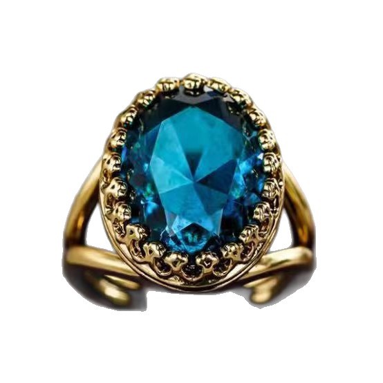 Gold ring with a large blue gemstone on a white background