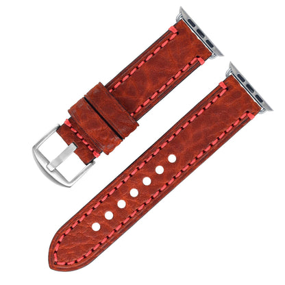 Brown leather watch strap with red stitching on a white background