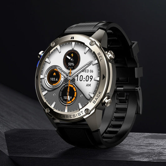 Black smartwatch with rugged round face, silver bezel, and black silicone band