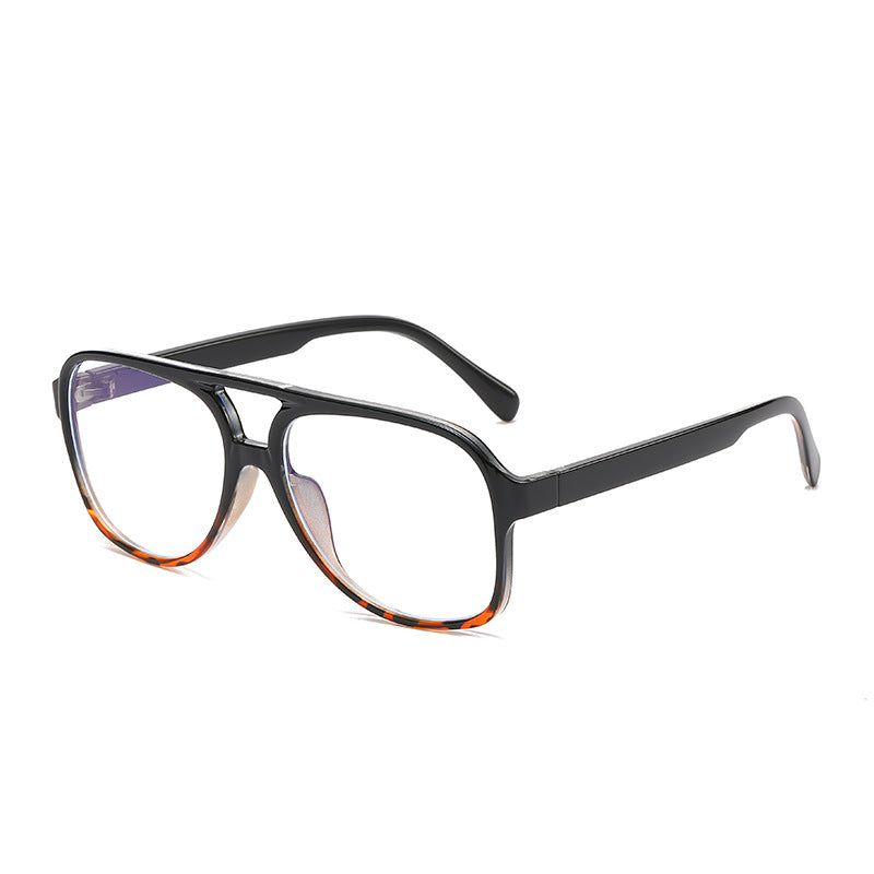 Black eyeglasses with a tortoiseshell pattern on a white background