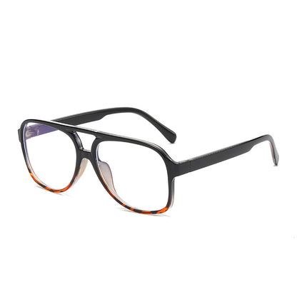 Black eyeglasses with a tortoiseshell pattern on a white background