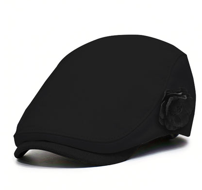 Black fabric beret with black flower accent and dark brim trim.