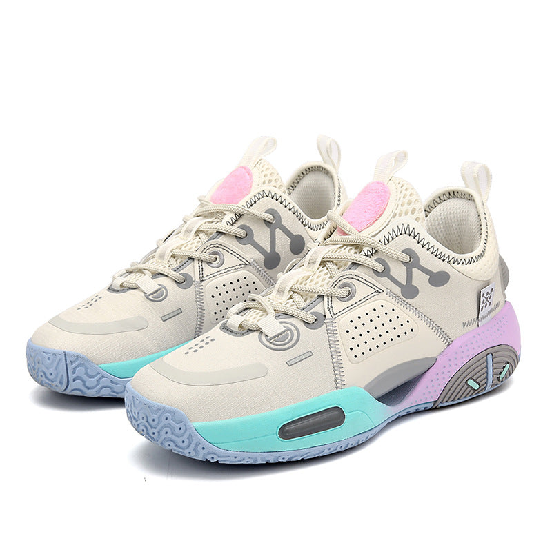 Pair of sneakers with pastel-colored soles on a white background