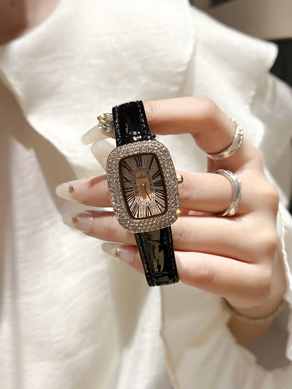 Women's diamond waterproof quartz watch with black leather-look strap and gold-toned details