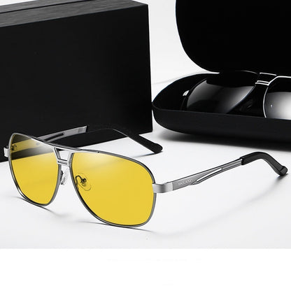 Gunmetal frame night vision lenses with yellow lenses on a white background