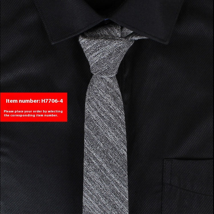 Black shirt with a gray tie and a red item number label.