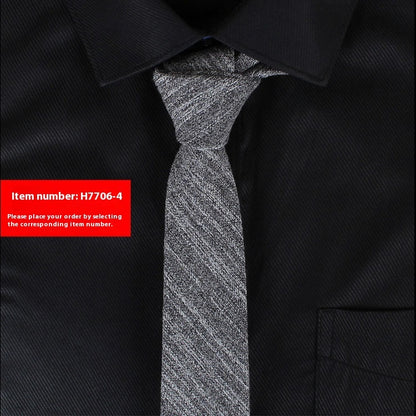 Black shirt with a gray tie and a red item number label.