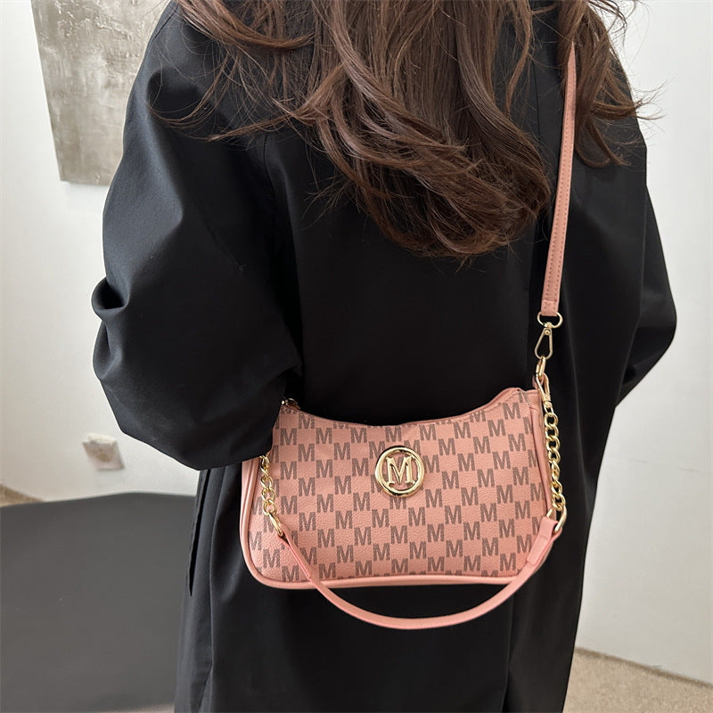 Women’s monogram shoulder pouch bag in dusty pink with gold chain strap