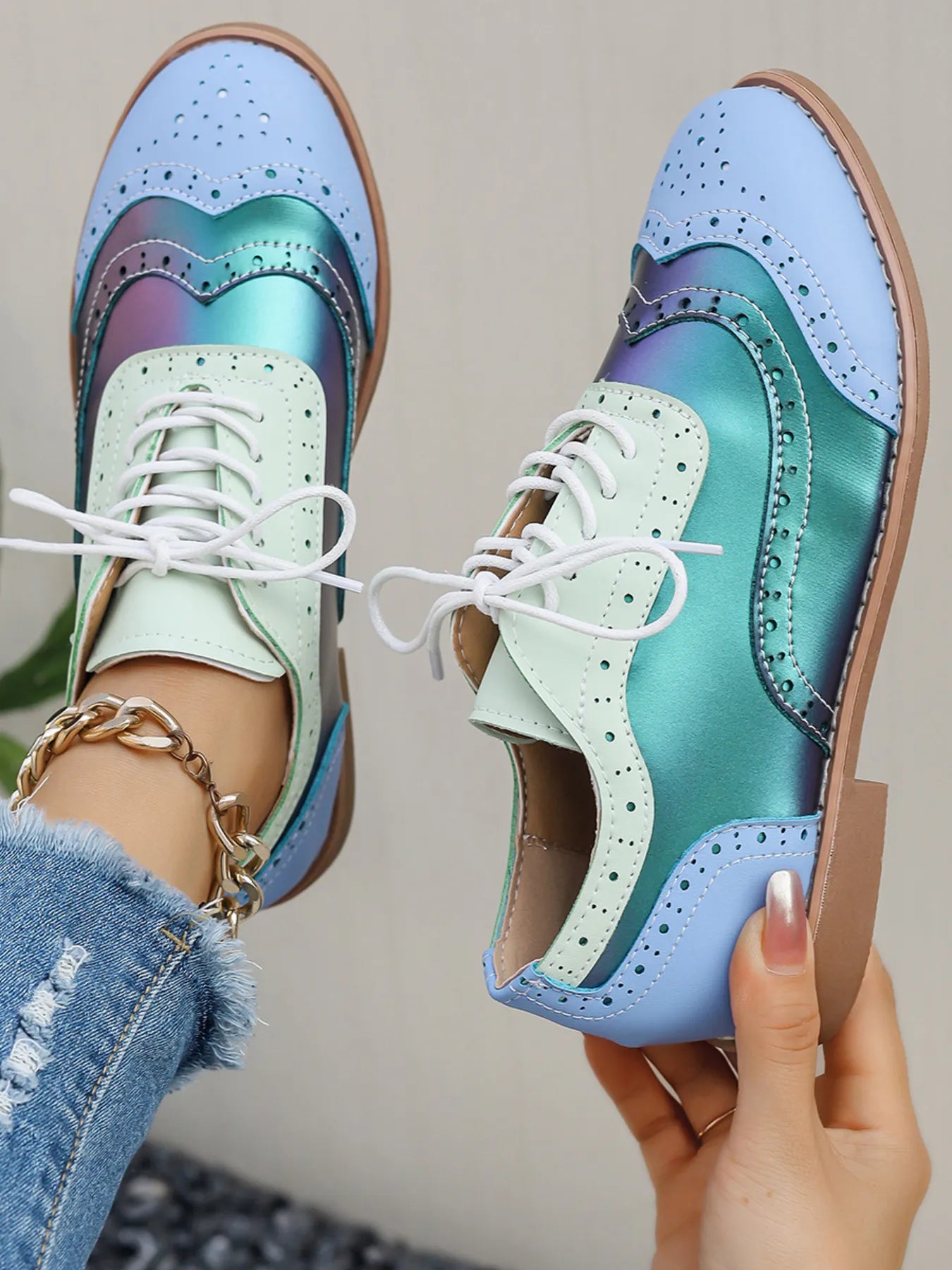 Pastel blue and mint color-block lace-up flats with perforations, round toe, white laces