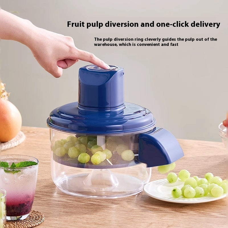 Fruit pulping device with grapes on a wooden table, showing pulp diversion ring feature. YAXSO ONLINE STORE UAE