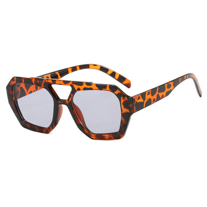 Sunglasses with a tortoiseshell frame on a white background
