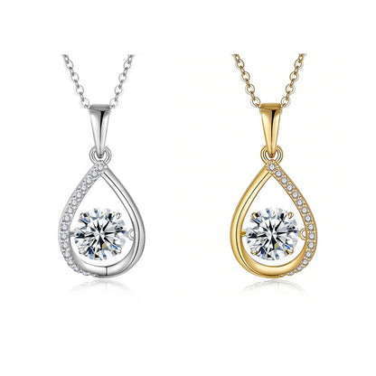 Two teardrop-shaped pendants, one gold and one silver, on white background