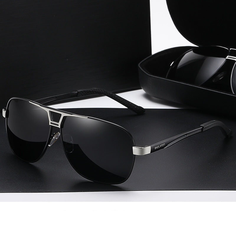 Black silver frame sunglasses with gray film on a dark background