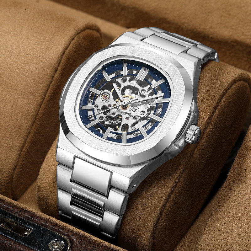 Silver wristwatch with a blue face on a brown cushion