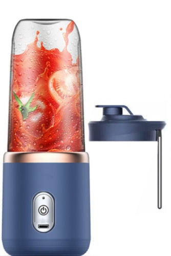 Navy blue portable blender with a glass container filled with a red smoothie on a white background