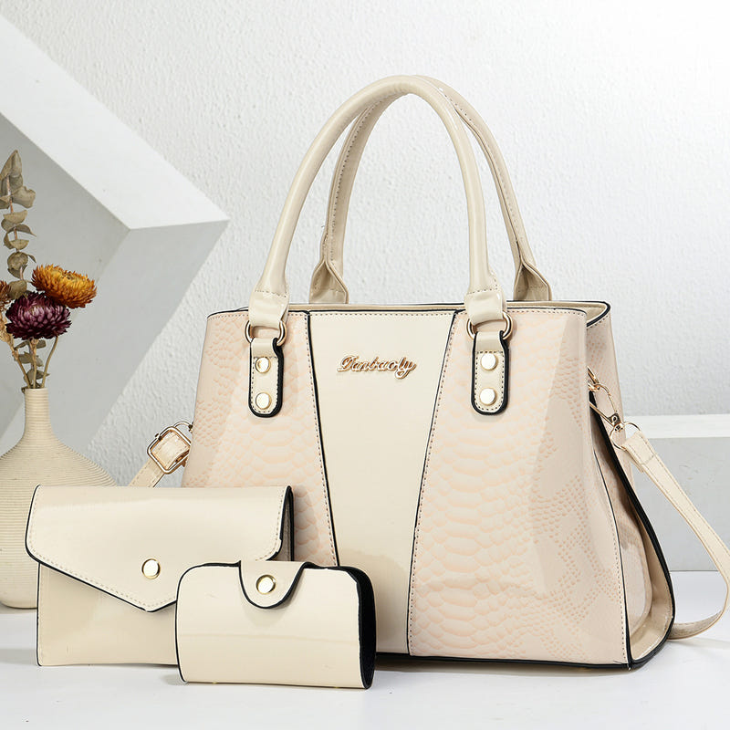 Cream shoulder tote bag with scalloped texture, front pocket, and matching wallet set
