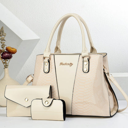 Cream shoulder tote bag with scalloped texture, front pocket, and matching wallet set
