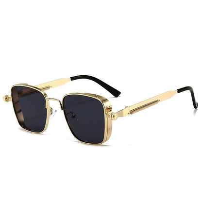Gold-framed sunglasses with black lenses on a white background