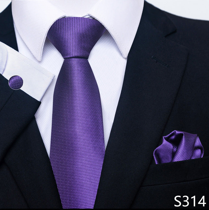 Purple tie and pocket square set with a black suit and white shirt