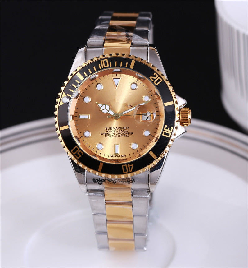 Steel wristwatch with gold-tone dial, stainless bracelet, black bezel with minute markers.