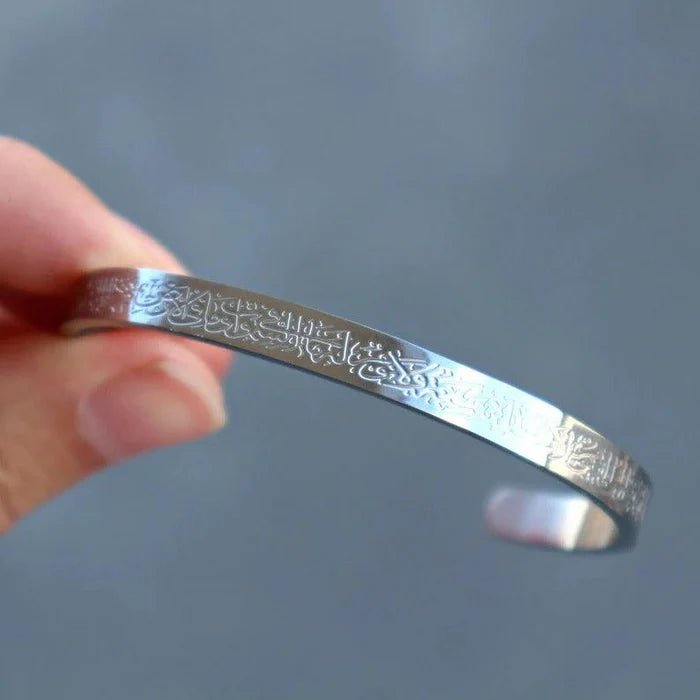 Metal bangle with engraved Islamic script, silver-tone wide cuff