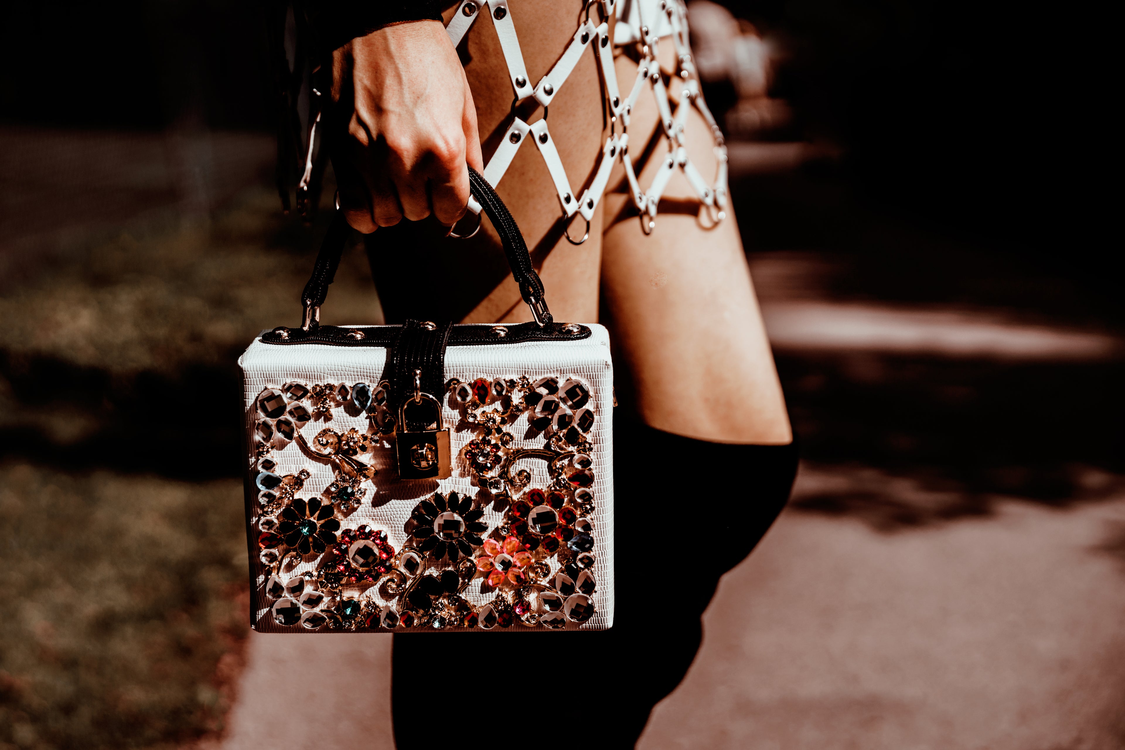Woman in stylish skirt holding purse – YAXSO women’s fashion