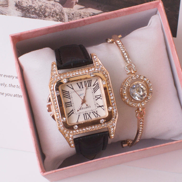 Women’s square rhinestone quartz watch with black strap and gold-tone charm bracelet