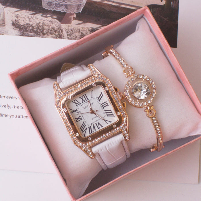 Women’s square rhinestone quartz watch with white strap and gold-tone crystal charm bracelet
