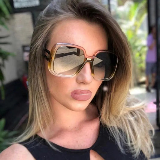 Large frame gradient sunglasses with peach-gold frame and dark lenses