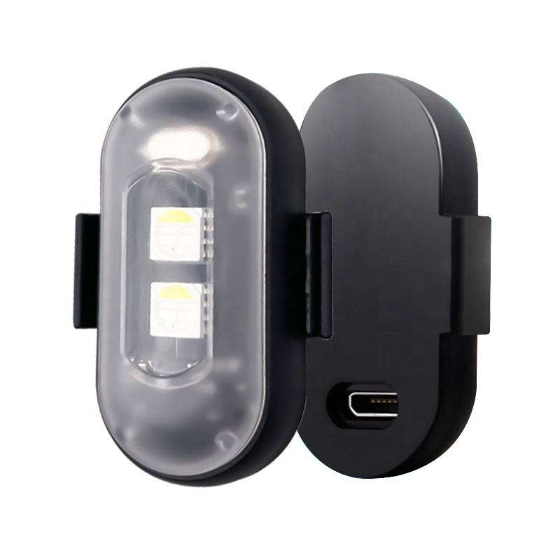 Pair of black wireless LED strobe lights with clear housings and charging port
