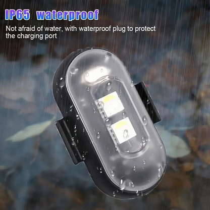 Waterproof black wireless LED strobe light with clear lens, raindrop speckled